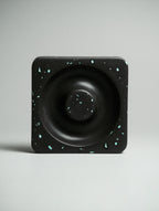 Kuro Design Ash Orbit terracotta red variant on a light minimal surface