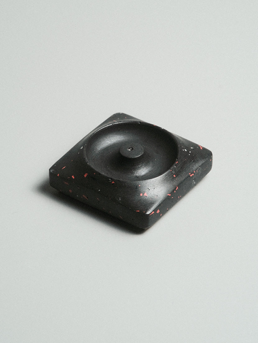 Kuro Design Kaze Incense Holder in black and red terrazzo variant — Jesmonite