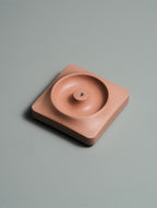 Kaze incense holder with incense smoke rising on a minimal desk setup — Kuro Design