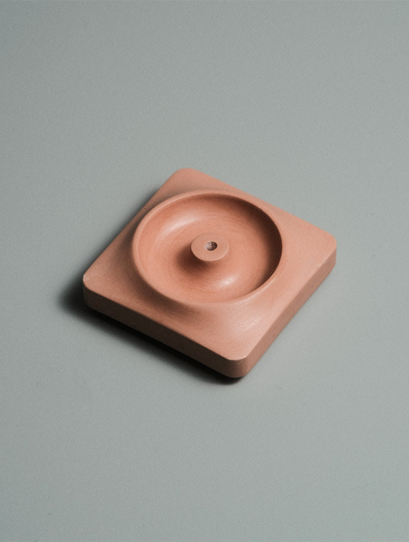 Kaze incense holder with incense smoke rising on a minimal desk setup — Kuro Design