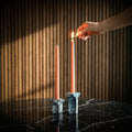 Kiva Candle Holder by Kuro Design styled with lit candle on a minimal desk