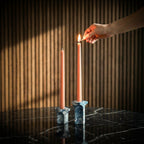Kiva Candle Holder by Kuro Design styled with lit candle on a minimal desk