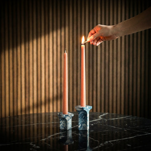 Kiva Candle Holder by Kuro Design styled with lit candle on a minimal desk