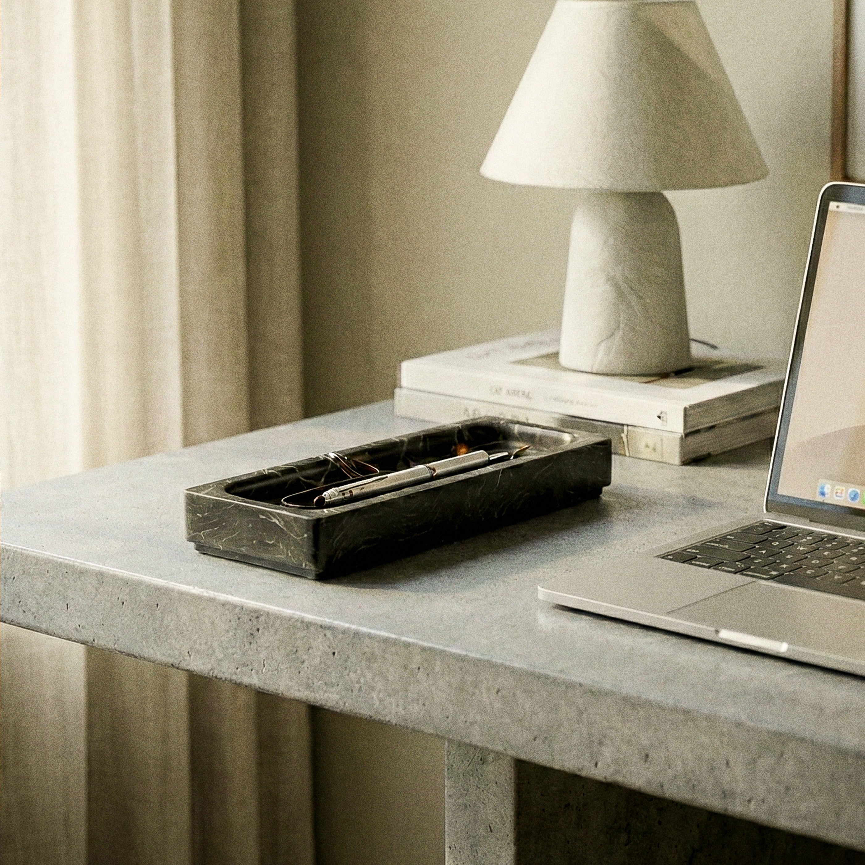Onyx Tray by Kuro Design holding pens and small stationery on a minimal desk